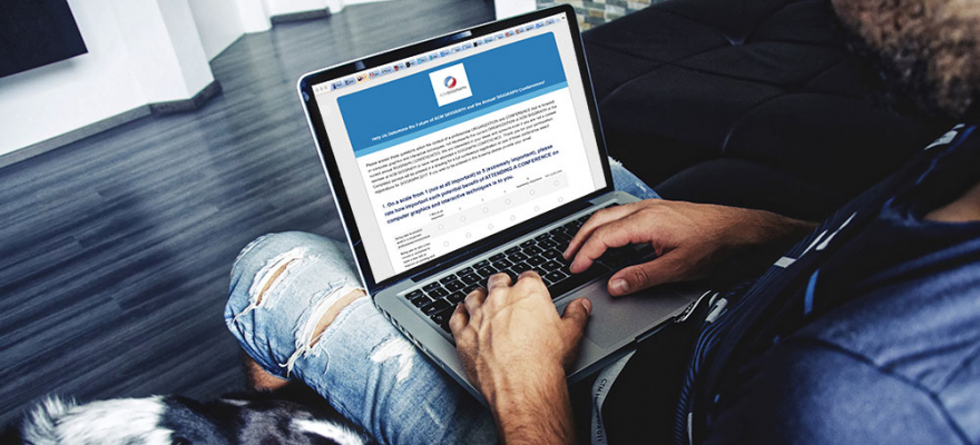 Man on laptop taking the ACM SIGGRAPH survey